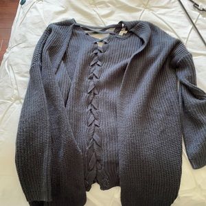 Navy blue sweater! With crisscross on the back.